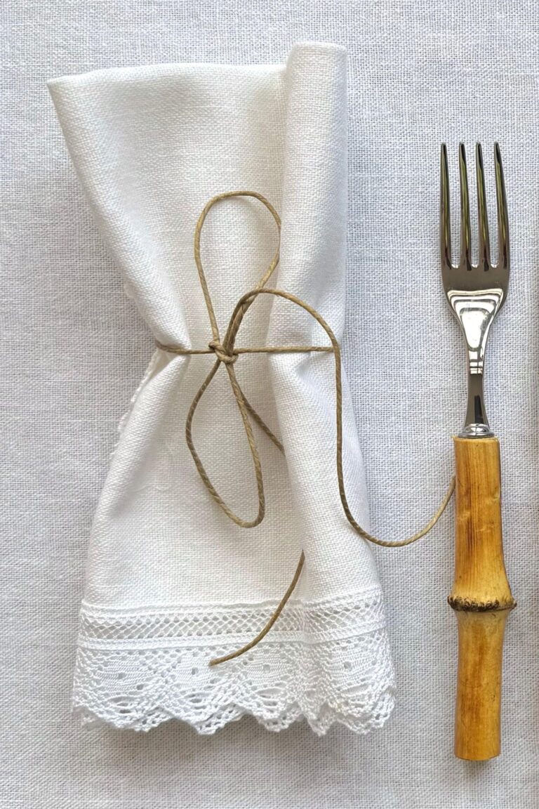 Elegant table setting with Fatima Linen Napkin placed neatly on a dinner plate