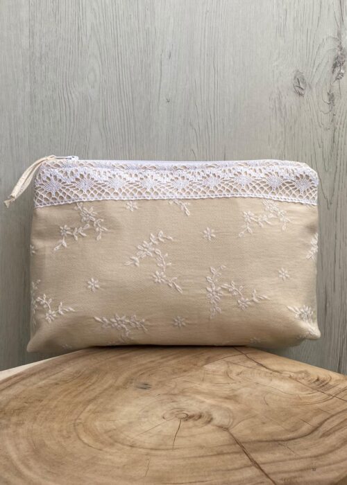 Manuela Cotton Necessaire in beige cotton with white embroidered flowers and lace trim, fully lined and structured.